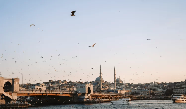 A ship sailing over the Galata Bridge and the sea in the background