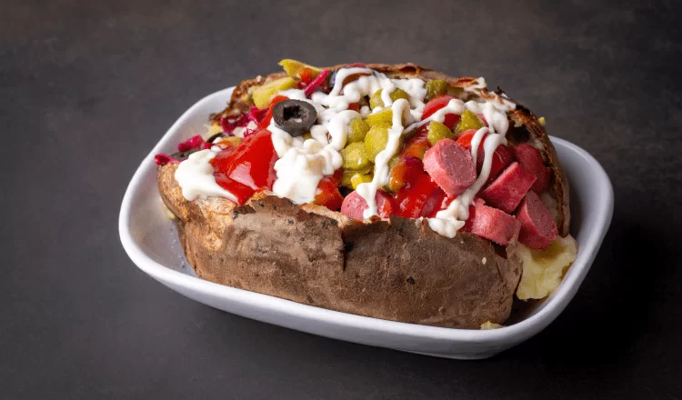 A portion of baked potato containing various ingredients