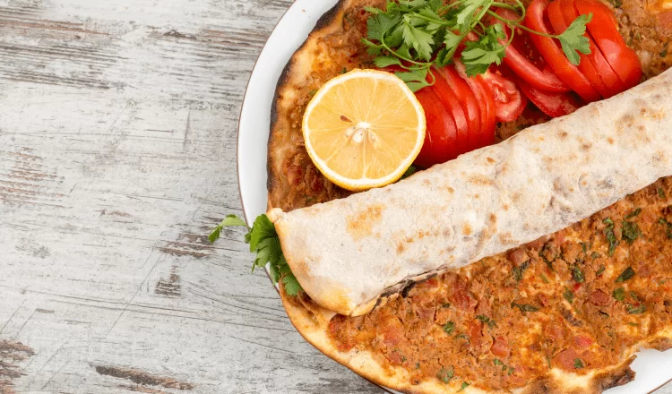 lahmacun with tomatoes, lemon and other ingredients