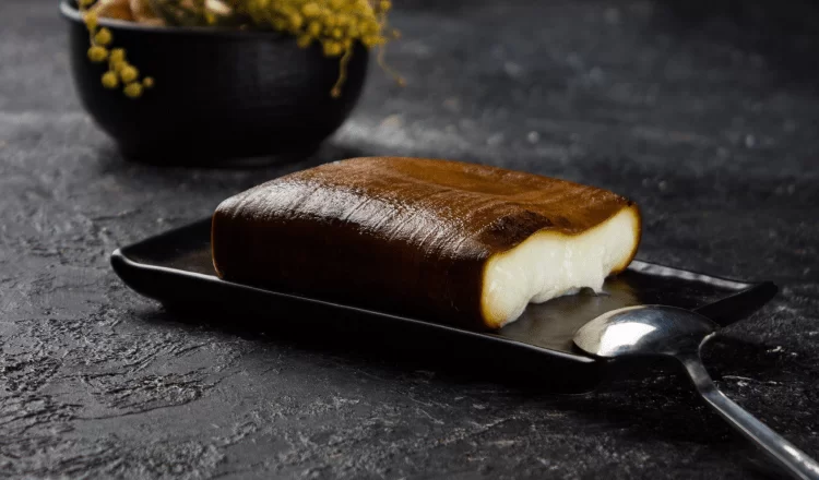 dessert and spoon standing on a black table