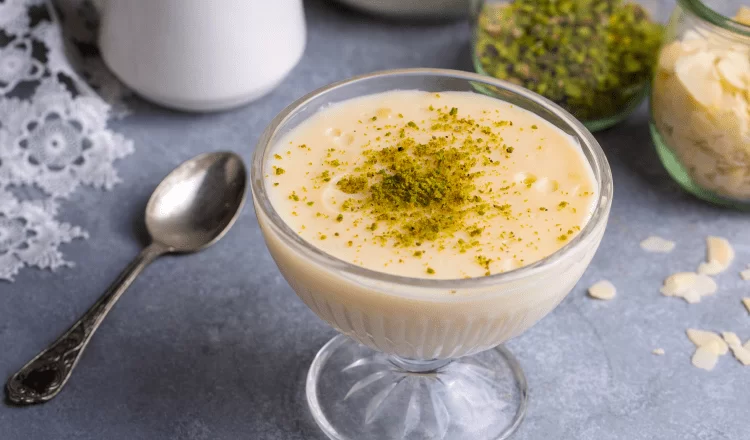 a bowl of dessert with peanut pieces on top