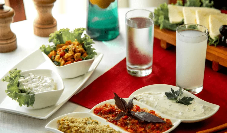 A visual with raki and appetizers