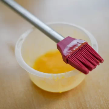 pastry brush standing on a bowl