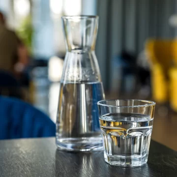 a bottle of water sitting on the table